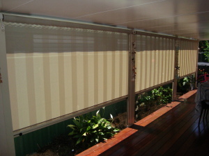 WInder Operated Side Channel Blinds with lock off mechanism in the bottom rail